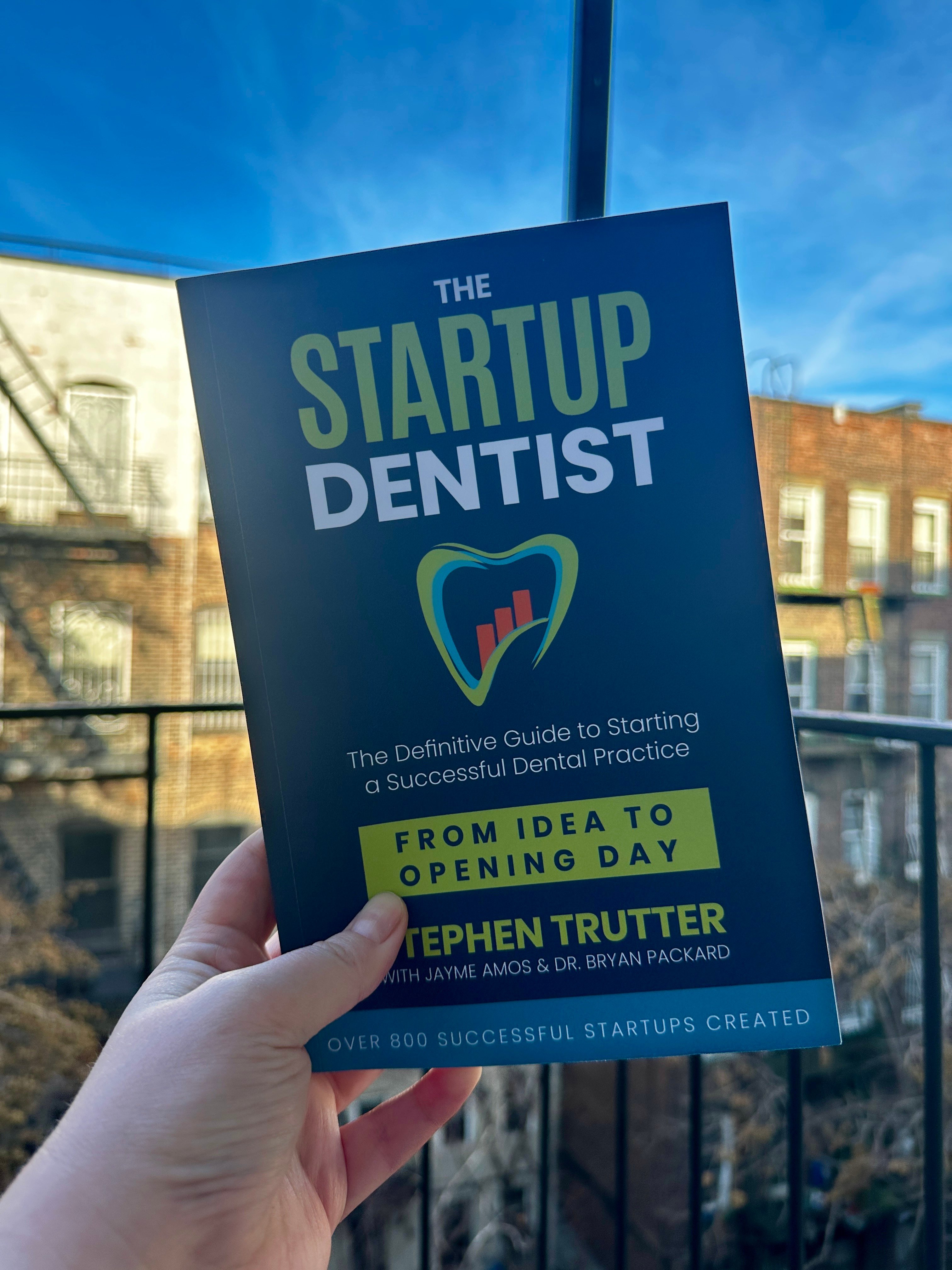 The Startup Dentist book held by a reader