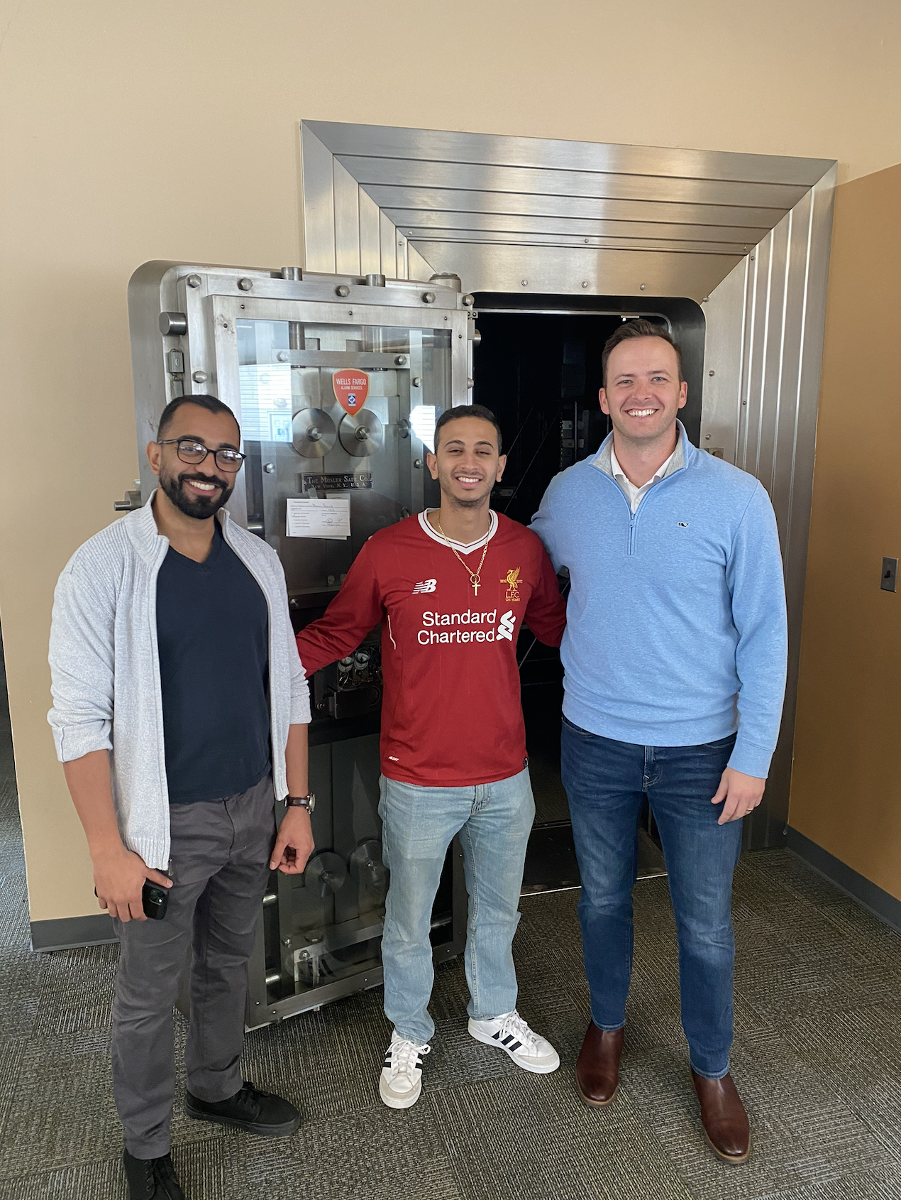 Ideal Practices team member reviewing plans on construction site